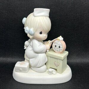 Precious Moments "Time Heals"  figurine